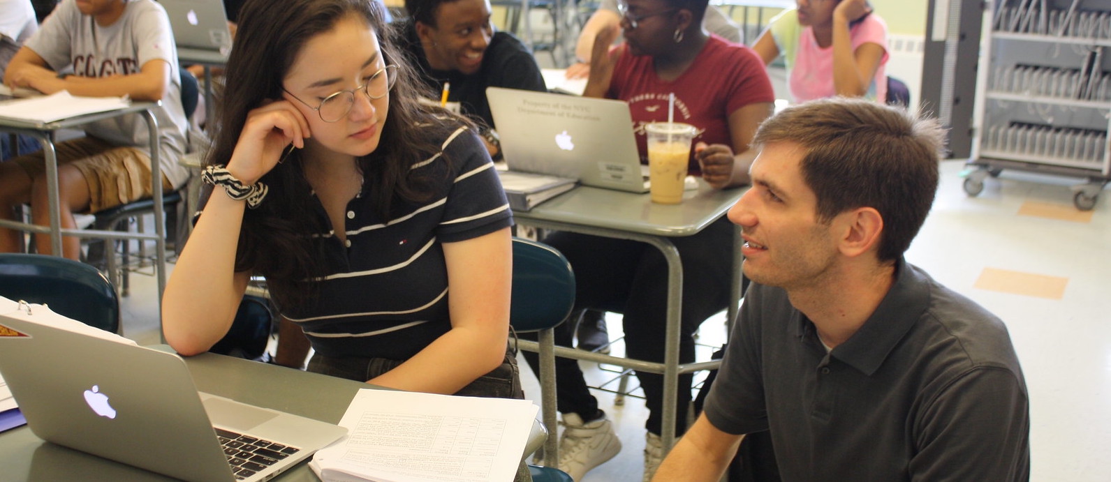 Matt working with a student in computer science class.